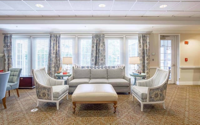 Bright common area with seating and windows