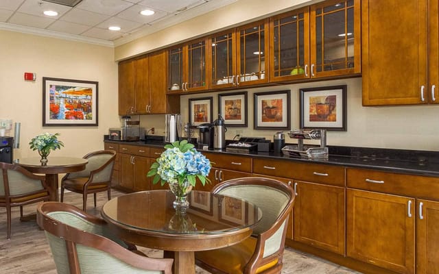 Cozy common area with wooden cabinetry and tables