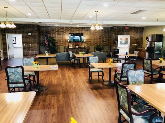 Bright dining room with tables and chairs