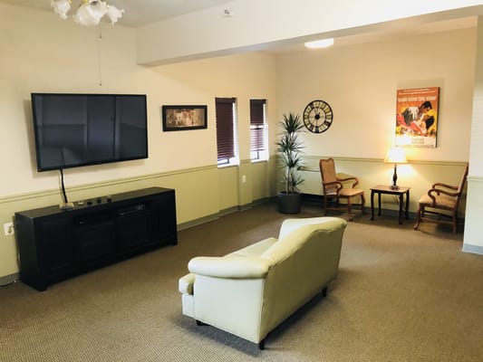 Common area with seating and television