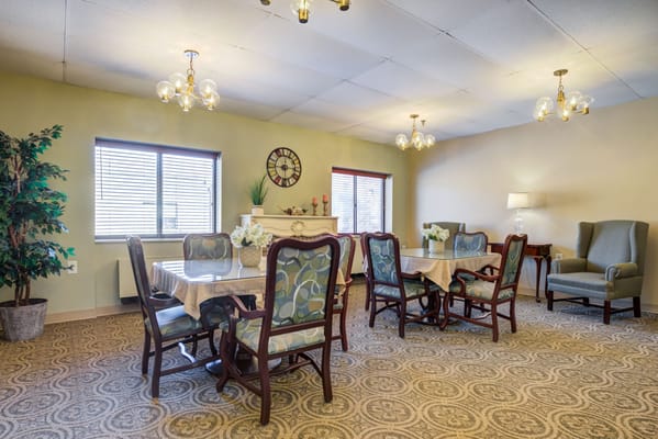 Bright common area with tables and chairs