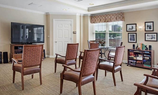 A common area with chairs and a television
