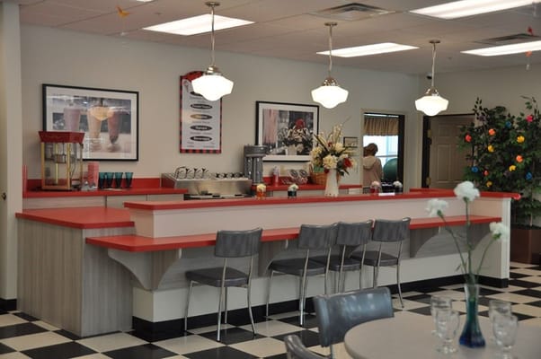 Interior view of a dining area with a counter and seating