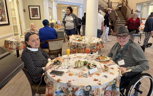 Residents enjoying a meal in the dining area