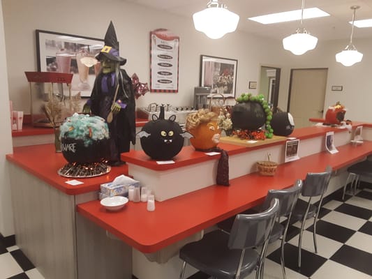 Decorated pumpkins and Halloween-themed displays in a common area