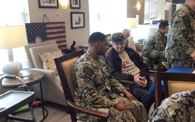 Residents engaging in conversation with a visitor
