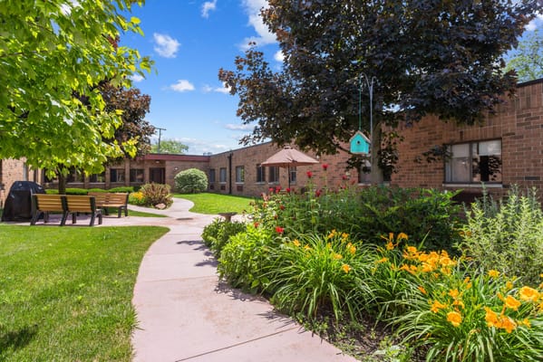 Beautiful garden area with walking path and seating