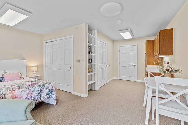 Bright interior of a resident room with floral bedding