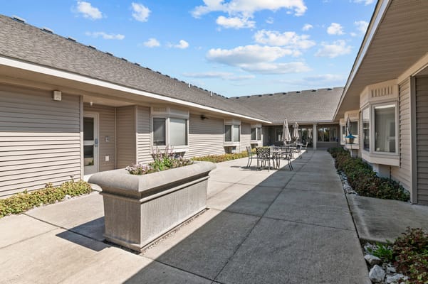 Outdoor patio area with seating and garden