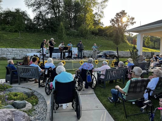 Residents enjoying live music in an outdoor setting