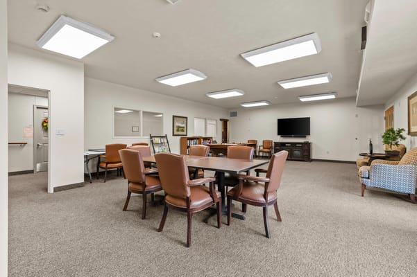 Bright common area with tables and seating