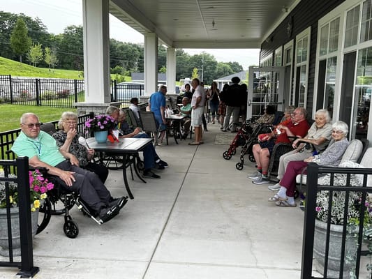 Residents enjoying time outdoors on a patio