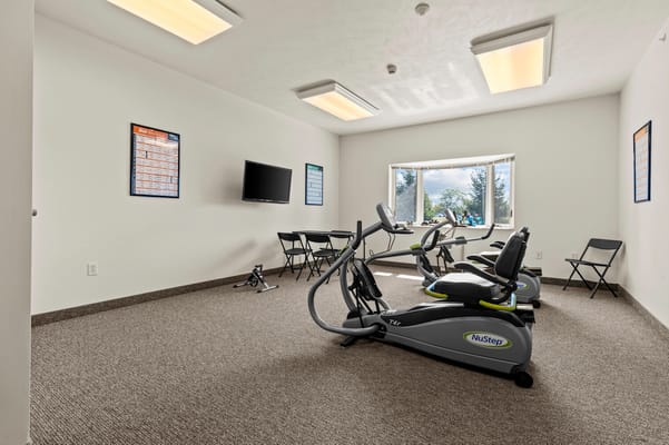 Interior view of a fitness area with exercise equipment