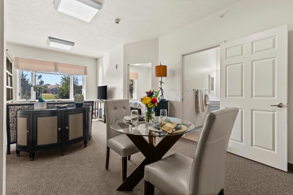 Interior view of a cozy resident room and dining area