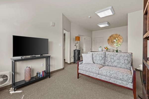 Cozy common area with a couch and TV