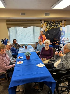 Residents celebrating a birthday in a common area