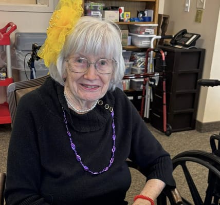 Resident in a common area wearing festive accessories