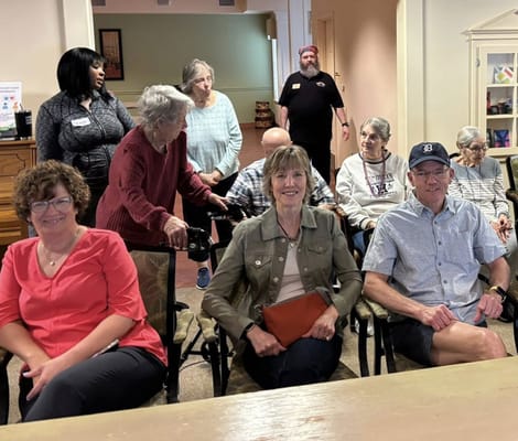 Residents and staff interacting in a common area