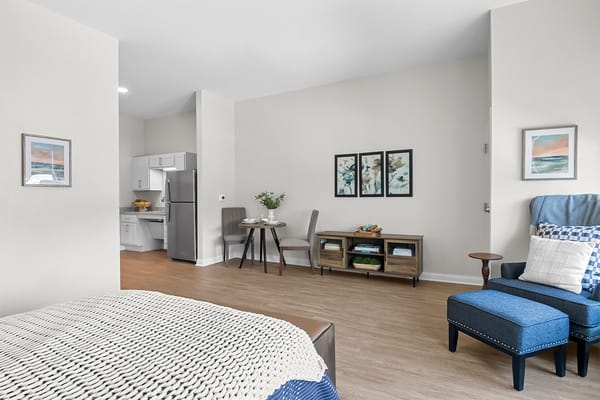 Bright, inviting room with kitchen and seating area
