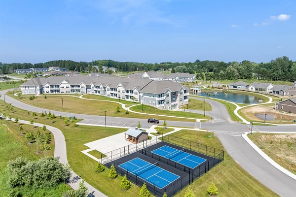 Aerial view of Meadow Valley with sports courts and pond
