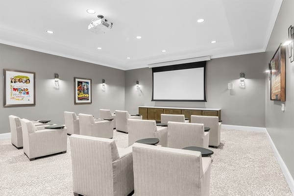 Interior view of a movie theater lounge with seating