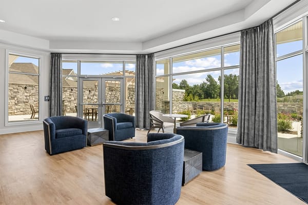 Bright common area with comfortable seating and outdoor view