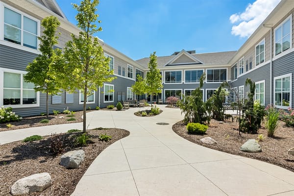 Outdoor courtyard with landscaped gardens and seating areas
