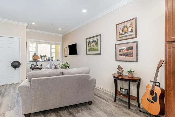 Cozy common area with a sofa and decorative art