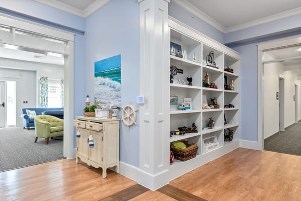 Interior common area with decorative shelf and furniture