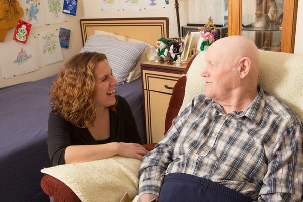 Resident and staff member enjoying a conversation