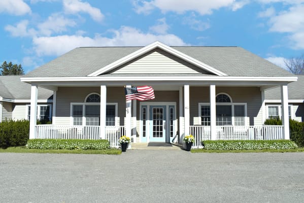 Exterior view of Bella Point Bridgton with American flag