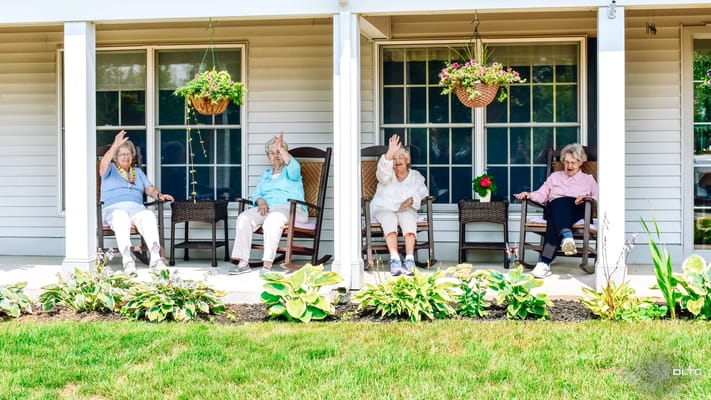 Residents sitting outside on a sunny day