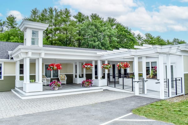 Front entrance of Bella Point Bridgton with flower baskets