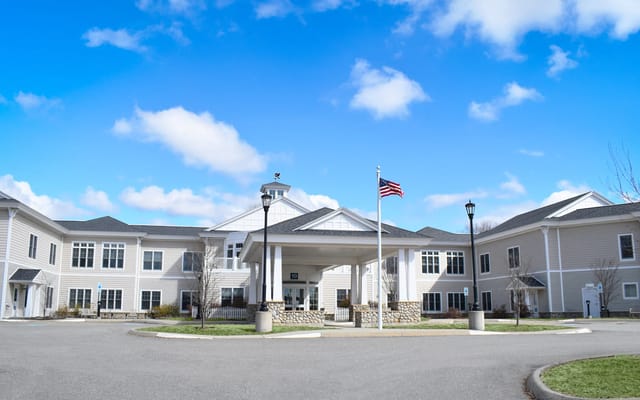 Exterior view of Bella Point Bridgton facility with flag