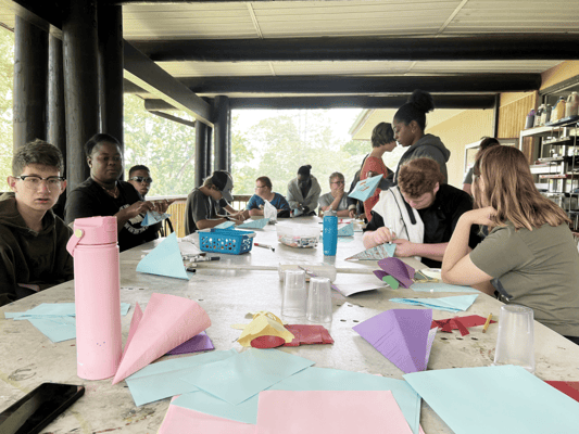 Residents participating in an arts and crafts activity outdoors