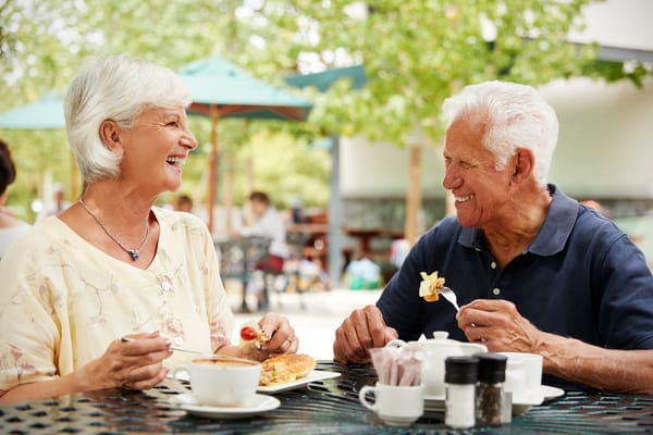 Senior couple enjoying a meal outdoors
