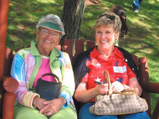 Residents smiling together in a garden area