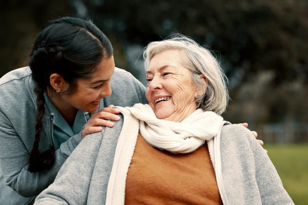 Caregiver interacting with a resident outside