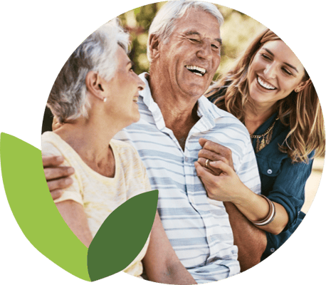 Residents enjoying time with staff in a warm setting