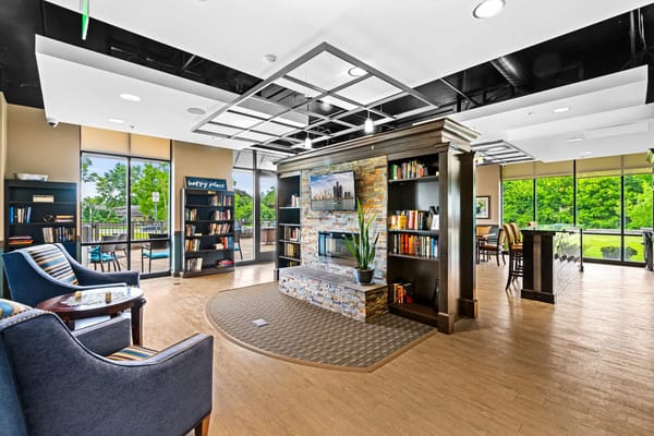 Bright common area with bookshelves and seating