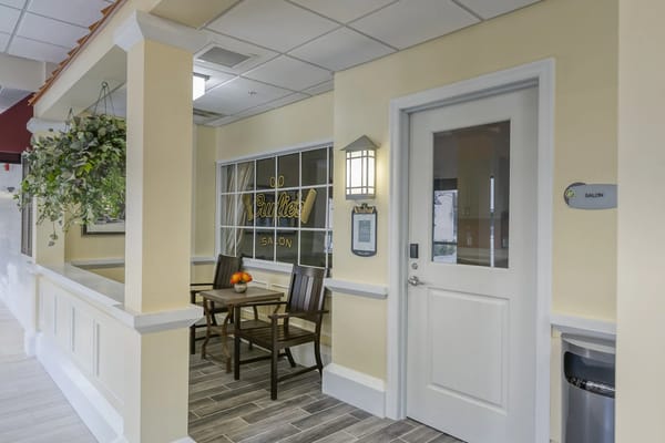 Indoor salon area with seating and decorations