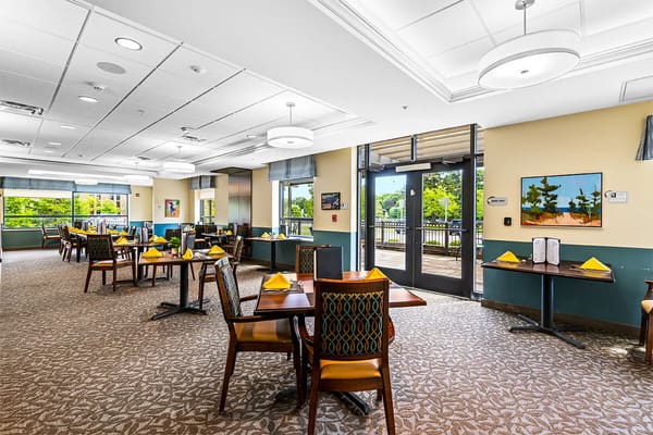 Bright dining area with tables set for meals