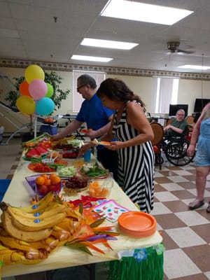 Residents enjoying a festive food spread during an event