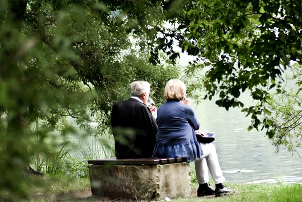 Couple enjoying a serene moment by the water