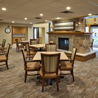 Interior common area with seating and a fireplace