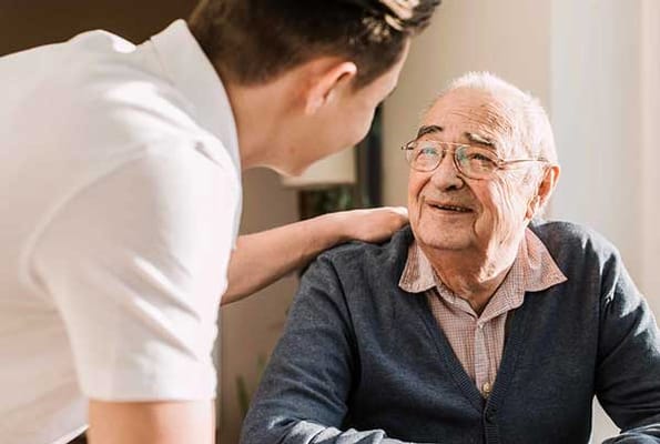 Care staff interacting with a senior resident
