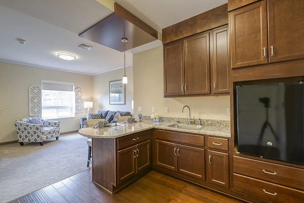 Well-appointed kitchenette in a resident suite