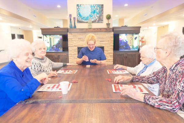Residents enjoying a bingo game in a common area