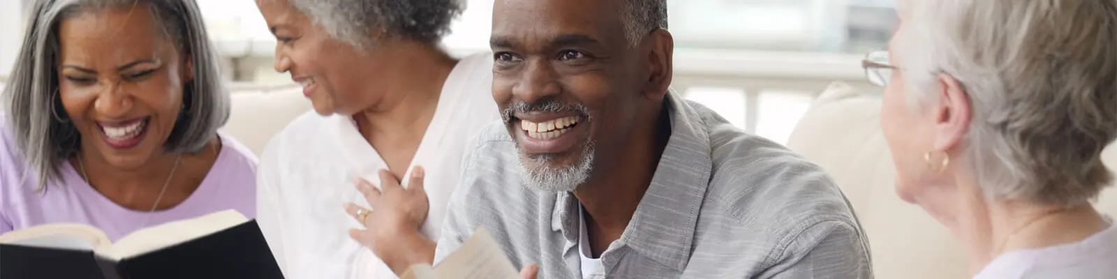 Residents enjoying a lively discussion in a common area