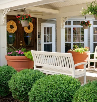 Outdoor seating area with potted flowers